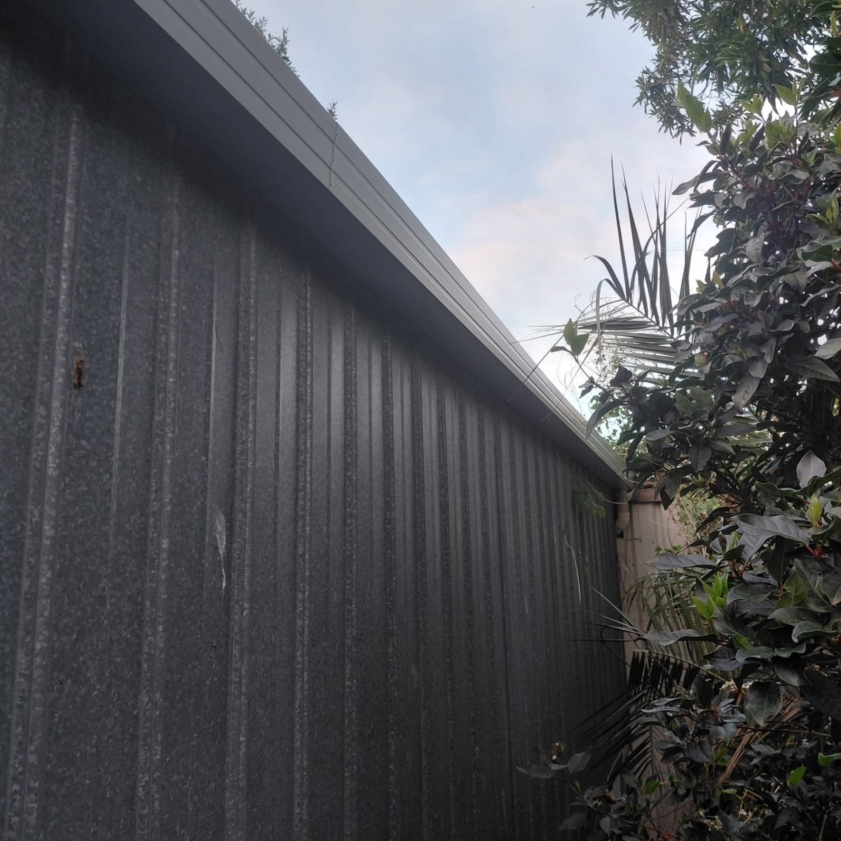 The same wall with a new gutter along the top